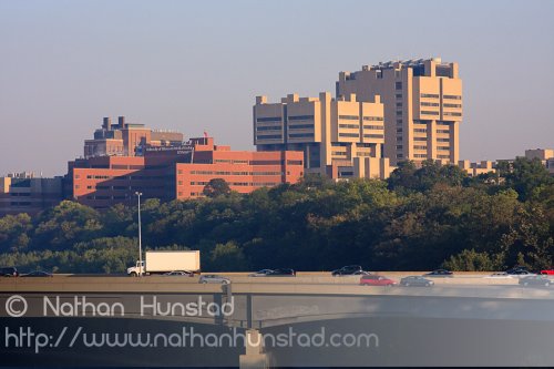 Moos Tower, Fairview University Medical Center, and the Masonic Cancer Research Center early in the morning, behind the Dartmouth I-94 bridge.